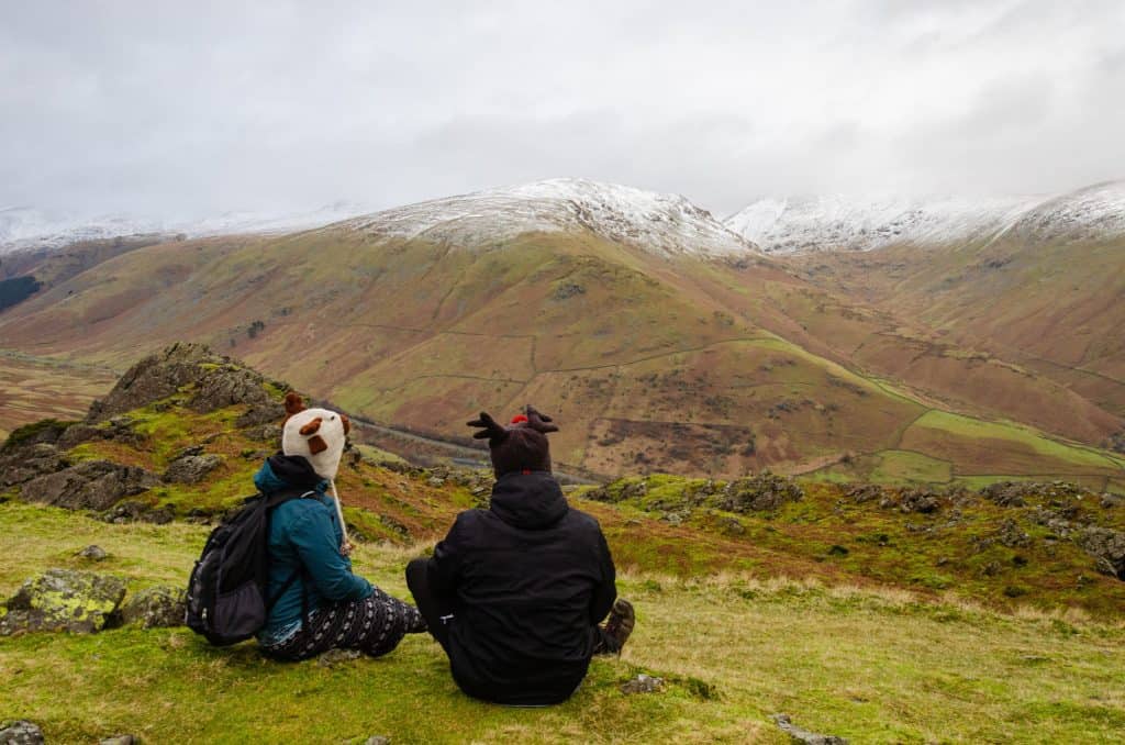 A couple looking at pikes of the Lake District in winter. A perfect Lake District weekend breaks.
