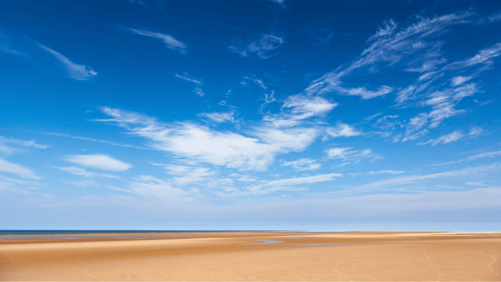 Holkham Beach on a sunny day, one of the best beaches in Norfolk.