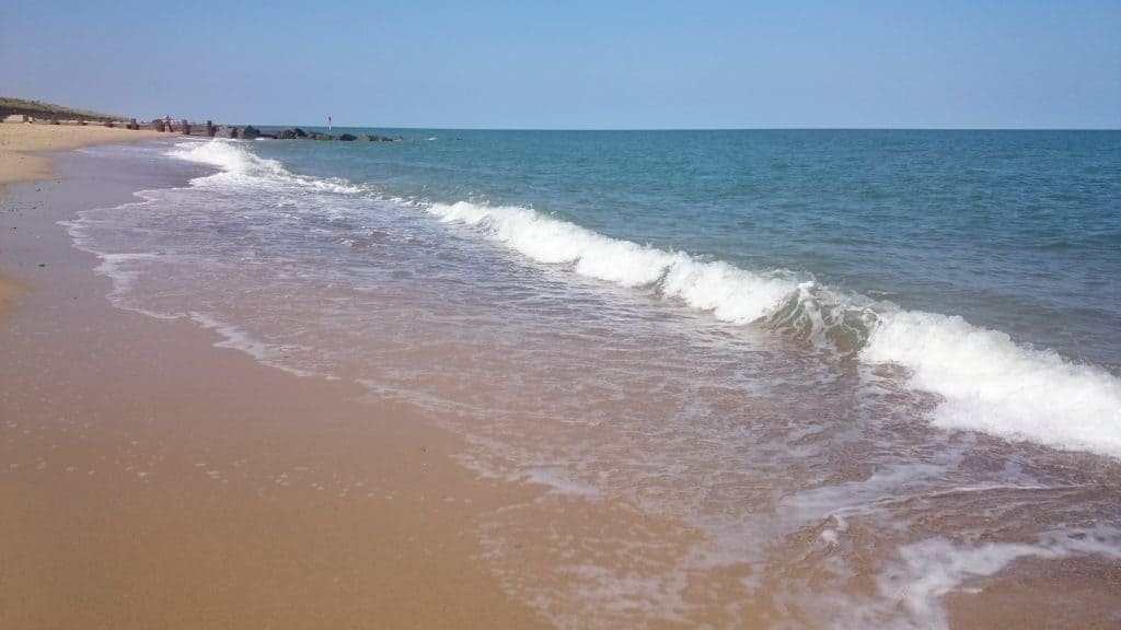 View at waves on Horsey Beach in Norfolk.
