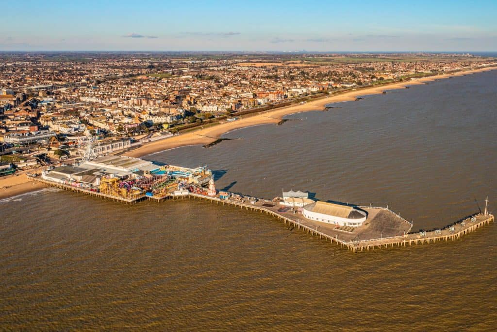 A view at the town of Clacton on Sea with sea, beach, pier and houses, 