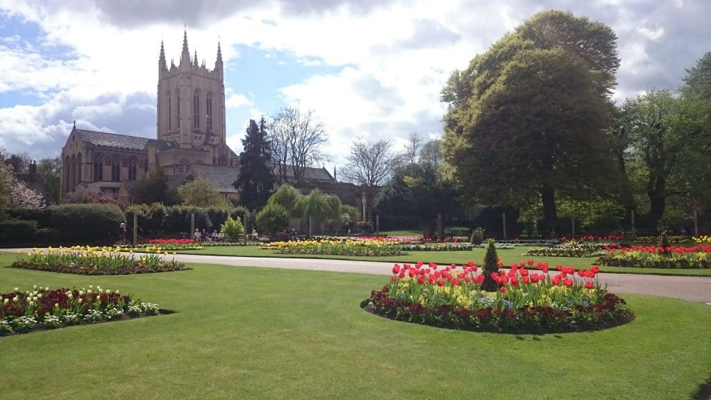 Best Bury St Edmunds attractions - View at the Cathedral from the Abby gardens with flowers in Bury St Edmunds