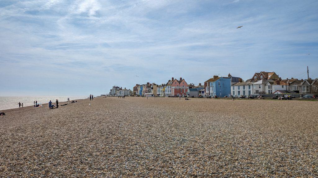 A walk on the Aldeburgh beach on a sunny day, one of the best things to do on Suffolk coast.