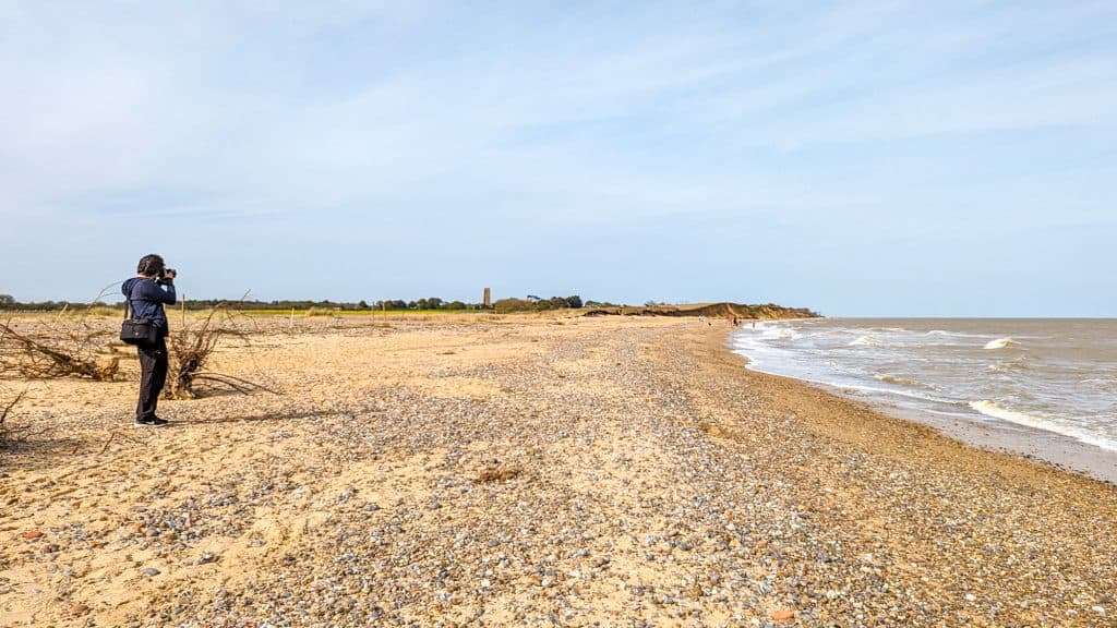 View at the Covehithe beach, one of the best beaches in Suffolk. A photographer taking pictures.