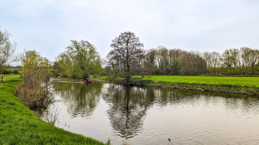 View at the river Stour with rowing boats near Dedham Boathouse in Constable Country in spring.