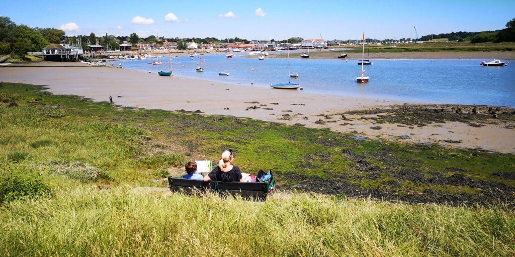 Views at the river Deben in Woodbridge Suffolk with boats on a sunny day.