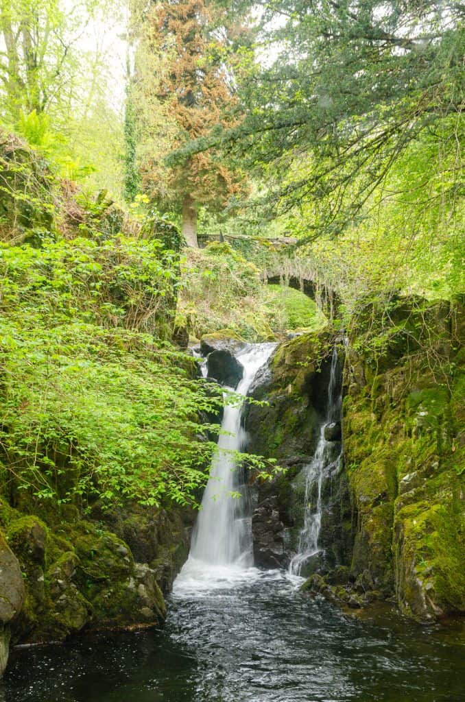 Rydal Force waterfall with bridge and trees.