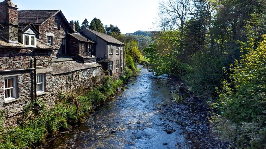 View at a river with houses in Grasmere