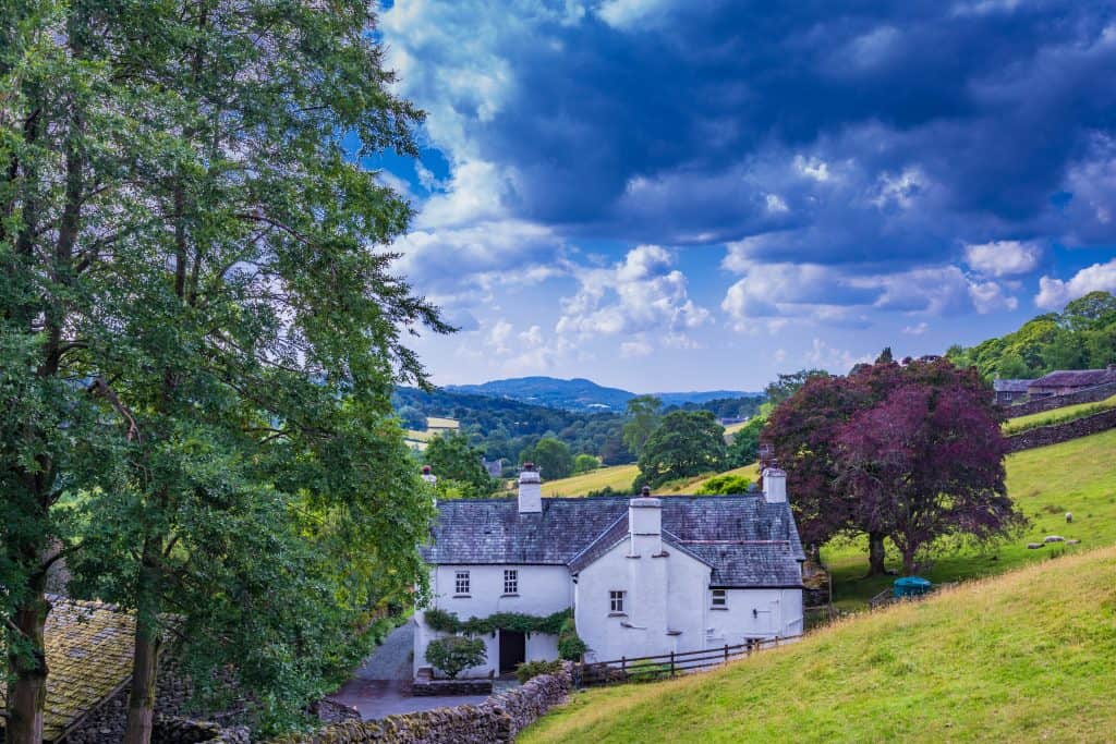 A rural house in vast fields of Windermere landscape.