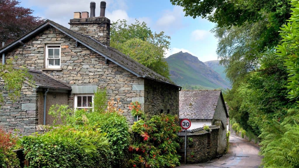View at stone cottages and a street.