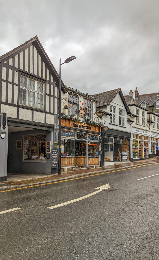 A street with pubs on a rainy day in Keswick.