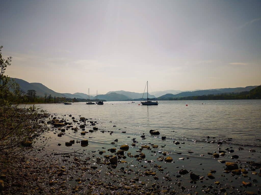 A lake with boats on a sunny day.