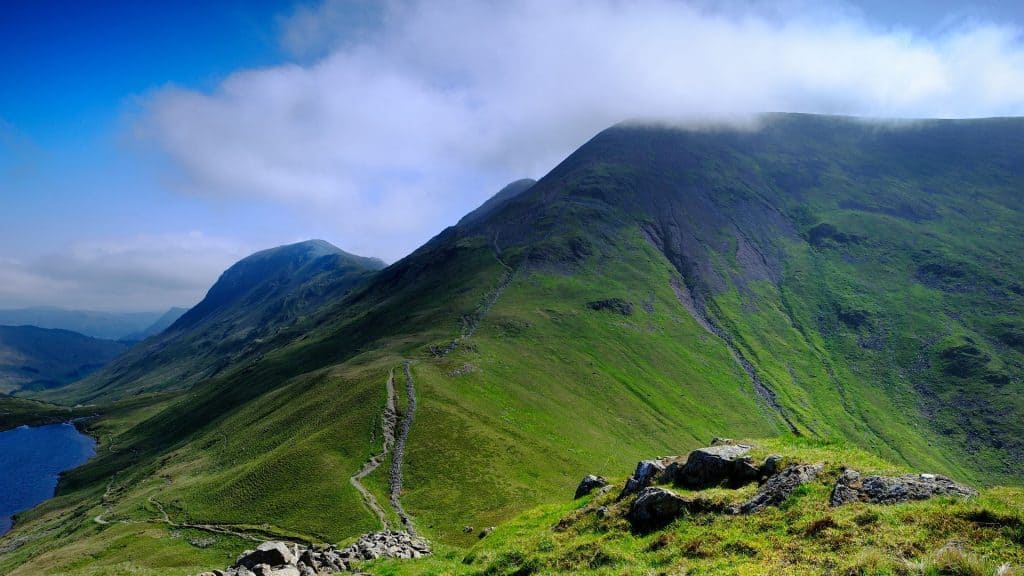 A detailed view on a mountain with a path.