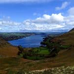 View at a valley with a lake on a sunny day.