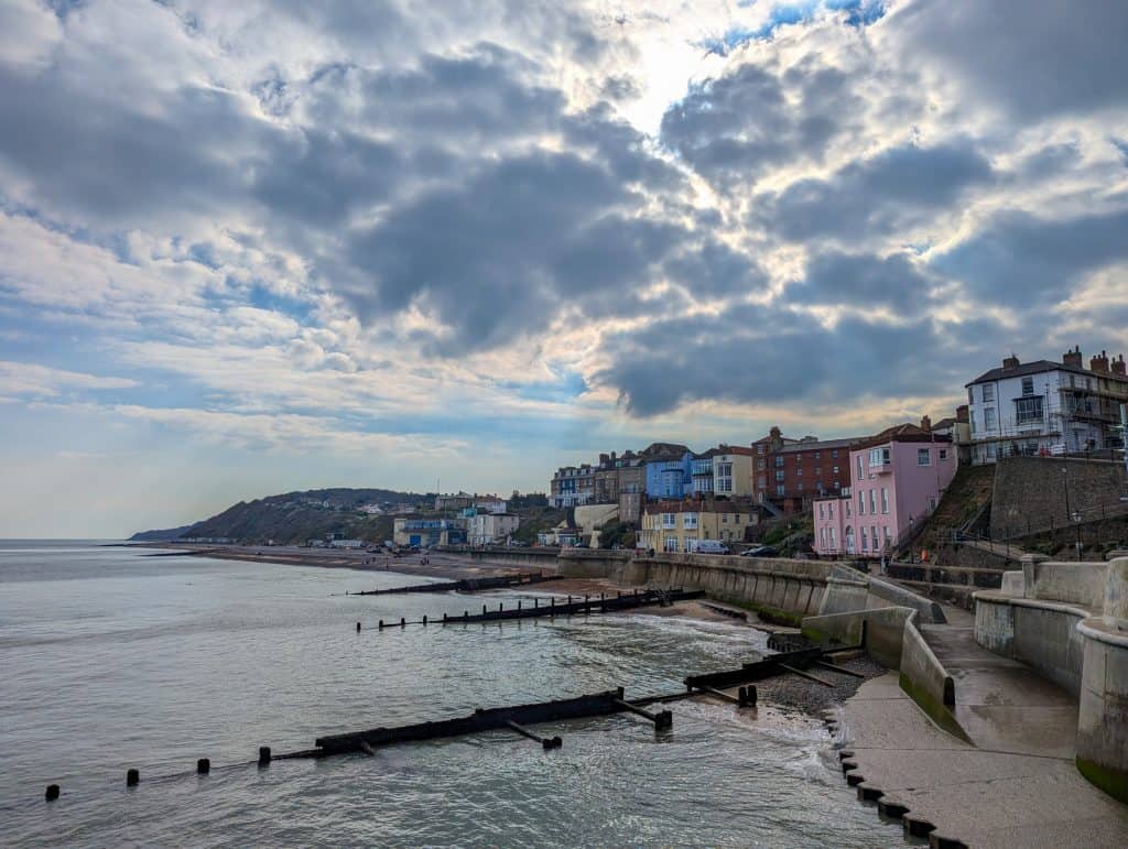 View at the beach and houses in Cromer from the Pier, one of the best seaside towns in East Anglia.