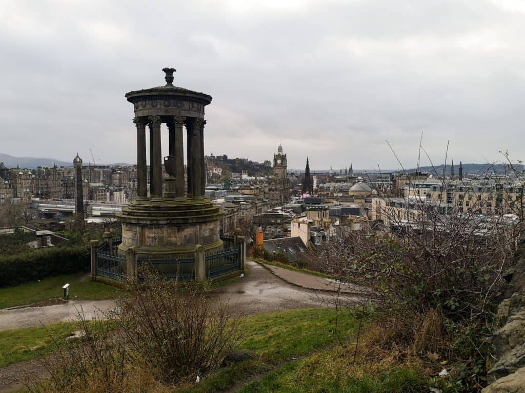 View at the Edinburgh city centre on a cloudy day in winter showing buildings and architecture.