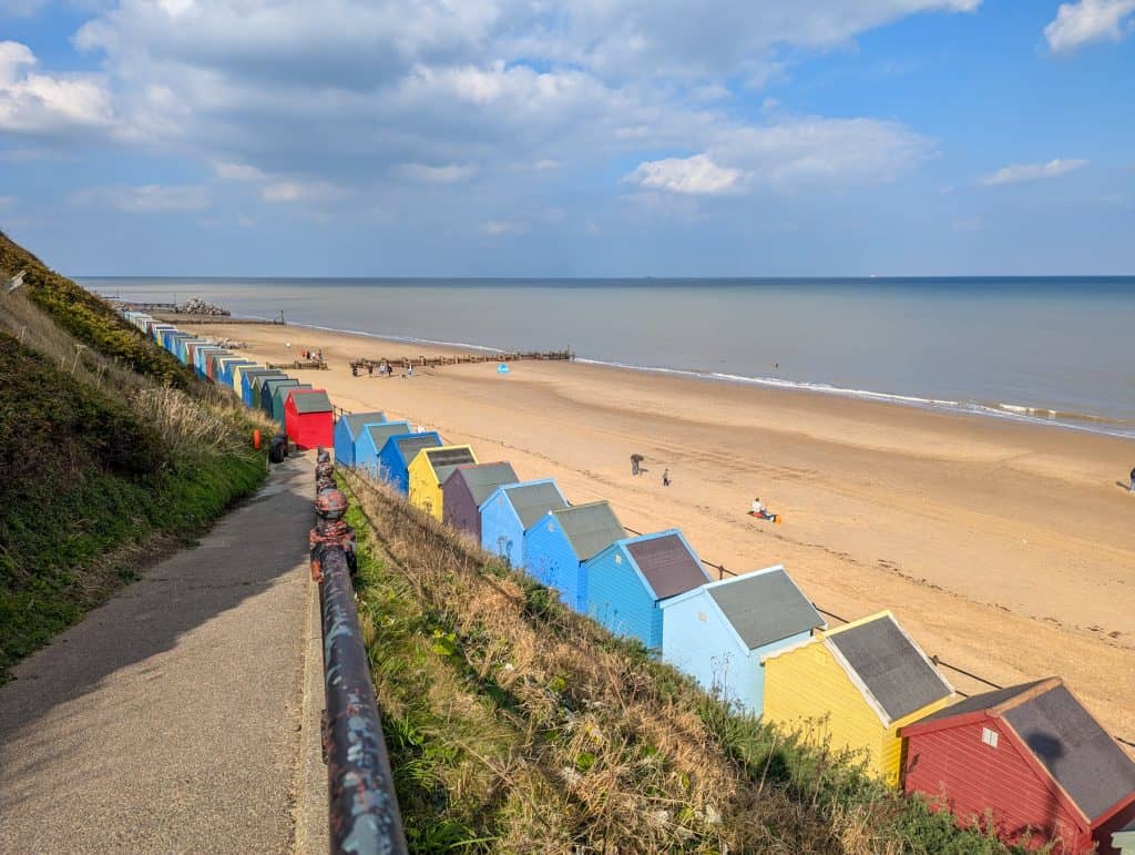 View at a Mundesley Beach with colourful huts on a sunny day in autumn.