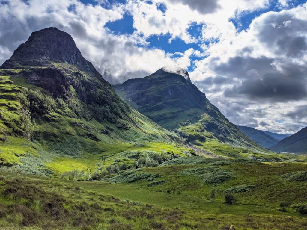View at the green mountains in Glencoe on a sunny day.