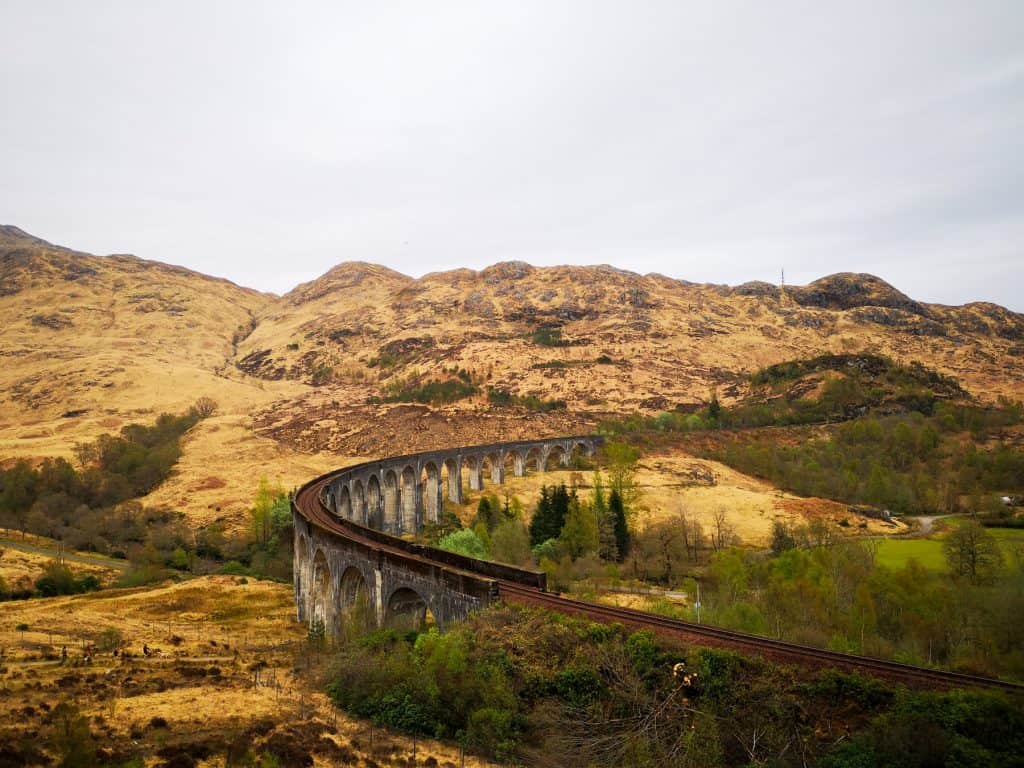 View at the Glenfinnan Viaduct, a railway bridge in Scotland in early spring, one of the must places to visit in Scotland.