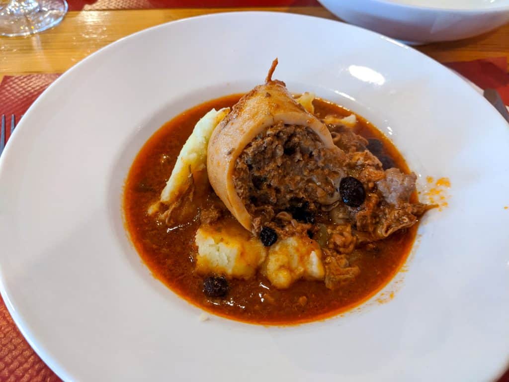A plate with food - stuffed squid with haggis.