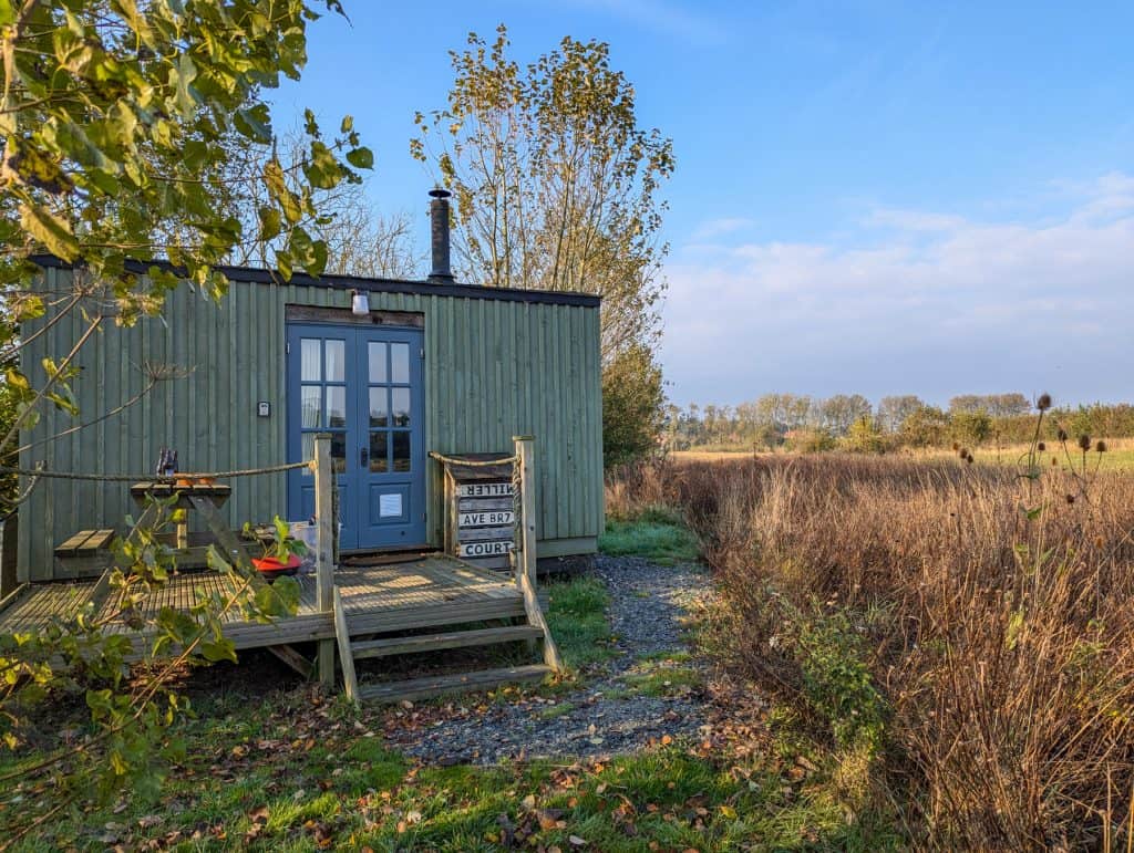 A small shepherd hut on a sunny autumn day.