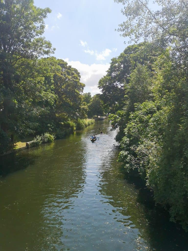 Kayaking on the river Wensum in Norwich on a sunny day, on of the great fun things to do in Norwich.