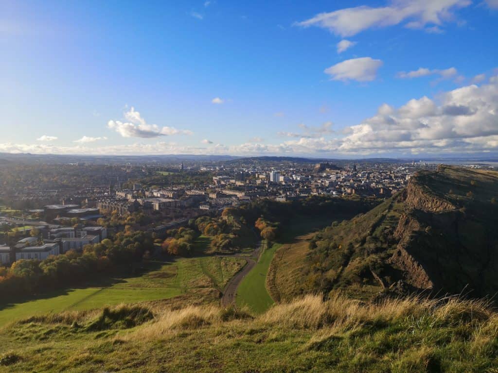 View at the Salisbury Crags and the city from one of the pathways to the Arthur Seat in Edinburgh.