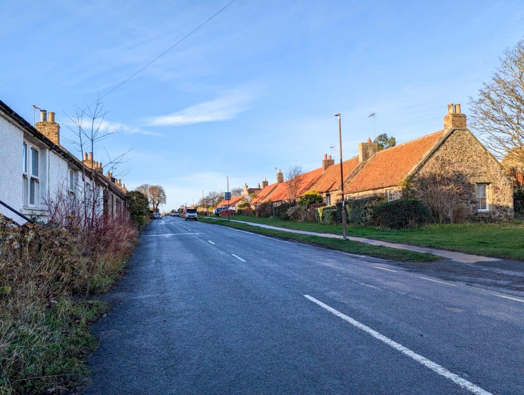 Athelstaneford Village - quiet street with small cottages on a sunny day.