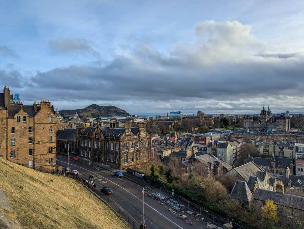 View at Edinburgh city centre from the viewpoint at the Edinburgh Castle, with Arthur's Seat at back.
