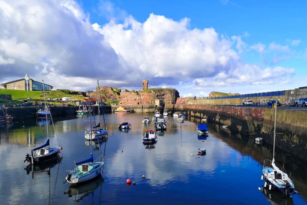 View at boats at the Dunbar Harbour on a sunny day.