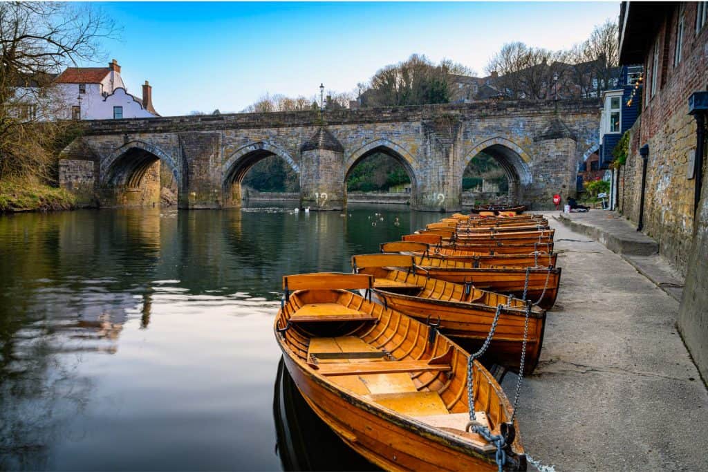 View at a bridge and wooden rowing boats in Durham.
