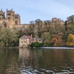 View at the cathedral, old house and river during the Durham river walk in winter. The walk is one of the best things to do in Durham for couples.