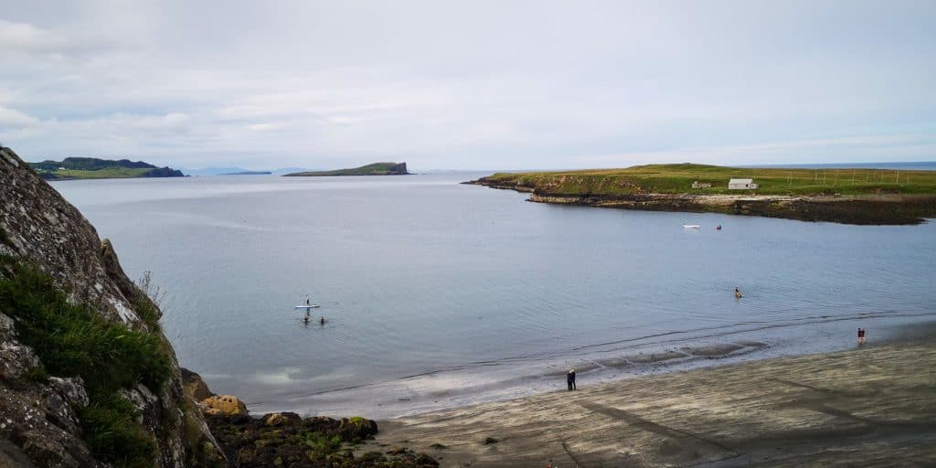 People paddleboarding near the Ann Coran beach.