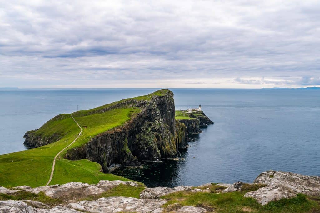 Neist Point Viewpoint with the lighthouse views and sea on a sunny summer day.