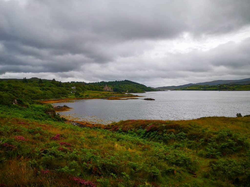 Viewpoint to the Dunvegan castle at distance and stunning greenery and lake.
