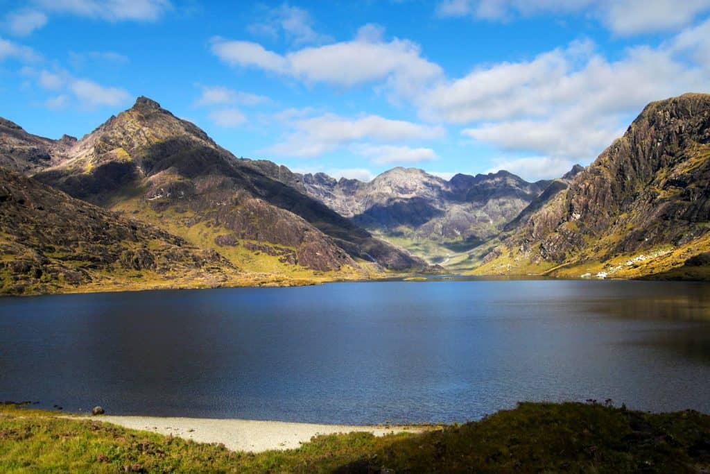 View at the Loch Coruisk with mountains at back on a sunny day.
