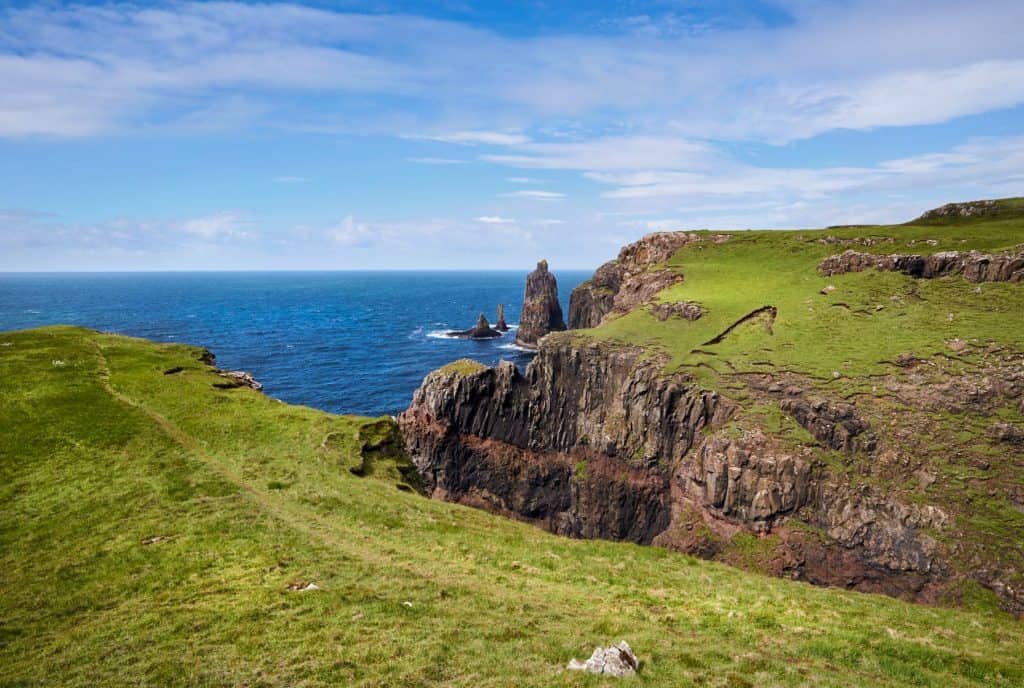 Cliffs with sea on a sunny day on the Isle of Skye.