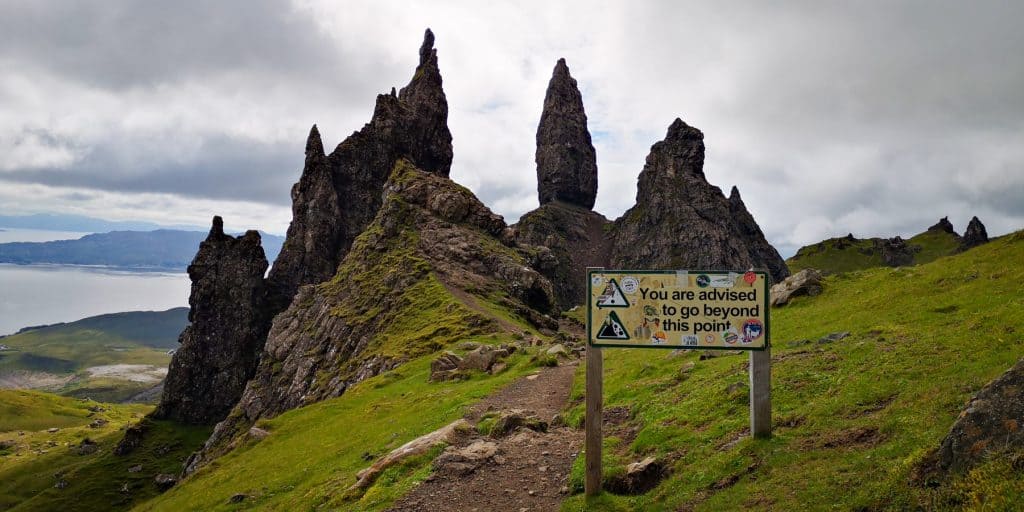 Old Man of Storr viewpoint with a sign saying 'you are advised to go beyond this point'; one of the best things to do on the Isle of Skye.