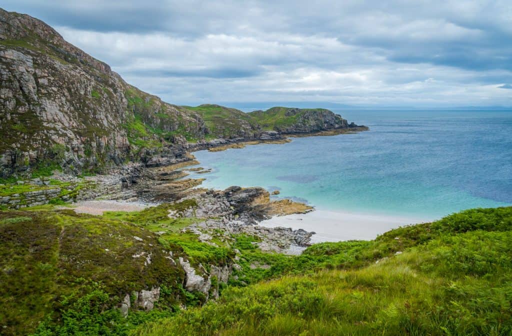 View at the beach on the Point of Sleat with rock formation.