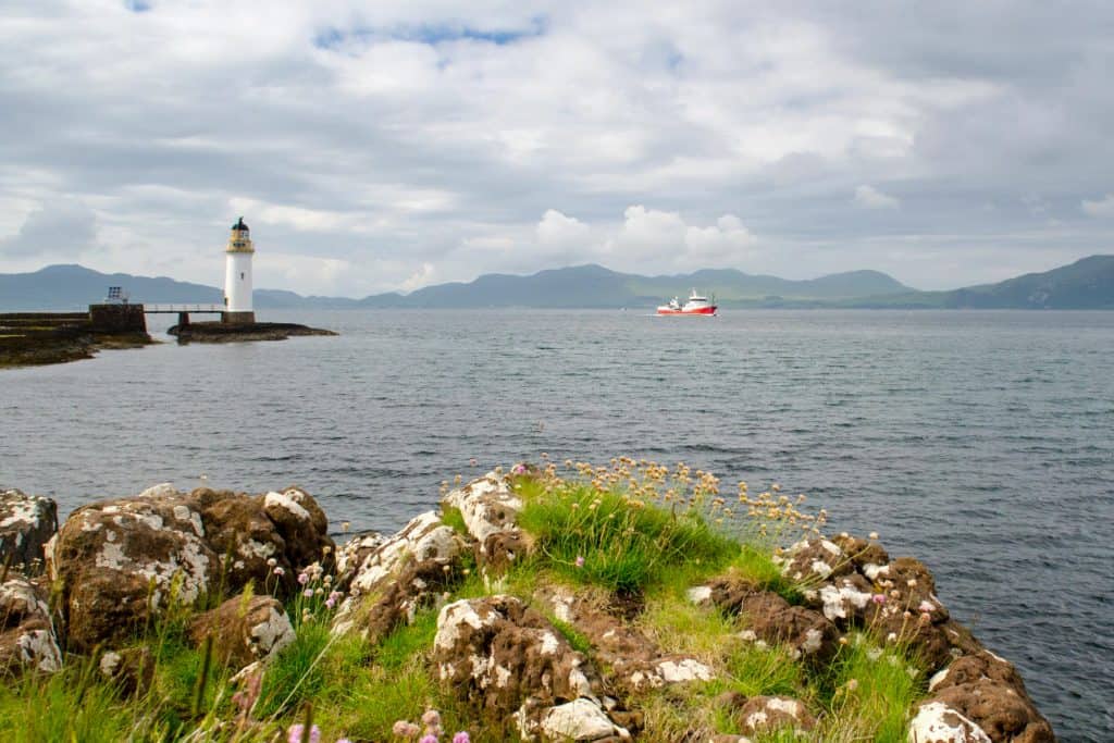Rubha nan Gall Lighthouse with a boat at back.