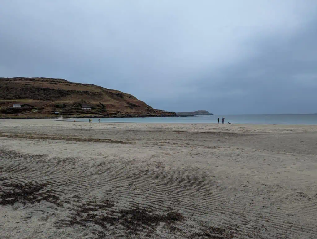 Calgary Beach on the Isle of Mull with people walking on the beach.