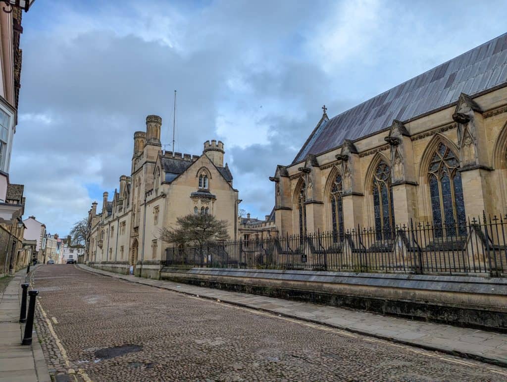 View at the street with mediaeval building of the Merton College in Oxford.