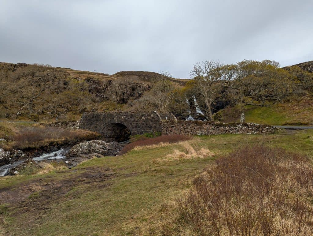 Eas Fors Waterfall - a view at the upper part of the waterfall and old stone bridge on Isle of Mull.