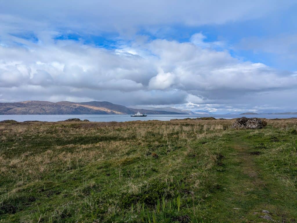 Views at the Isle of Mull coast with a boat at back.