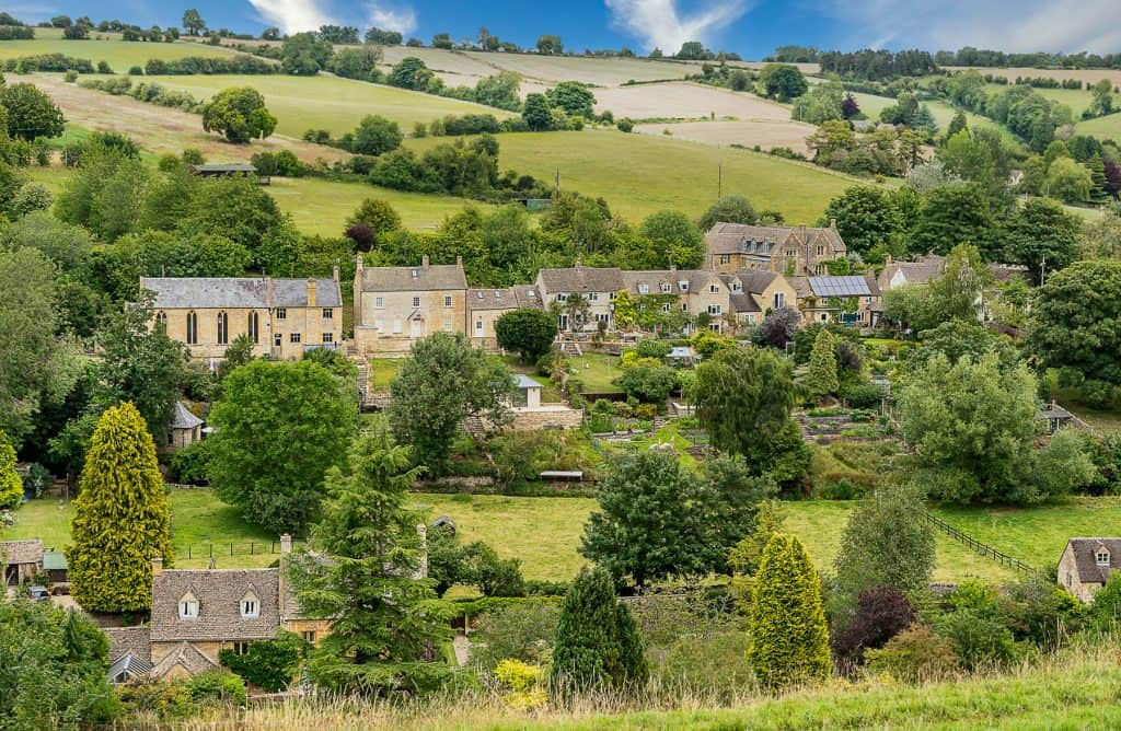 A historical village with cottages and meadows.