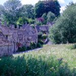 A view at a street with cottages in Bibury in spring, one of the best villages in the Cotswolds. Honey-coloured cottages, stone bridges and quiet lanes make the villages of the Cotswolds some of the most picturesque in England.