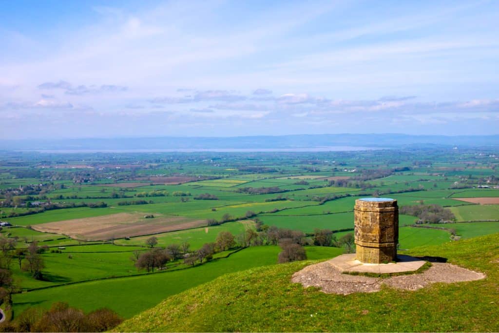 View from top of a hill to fields and meadows.