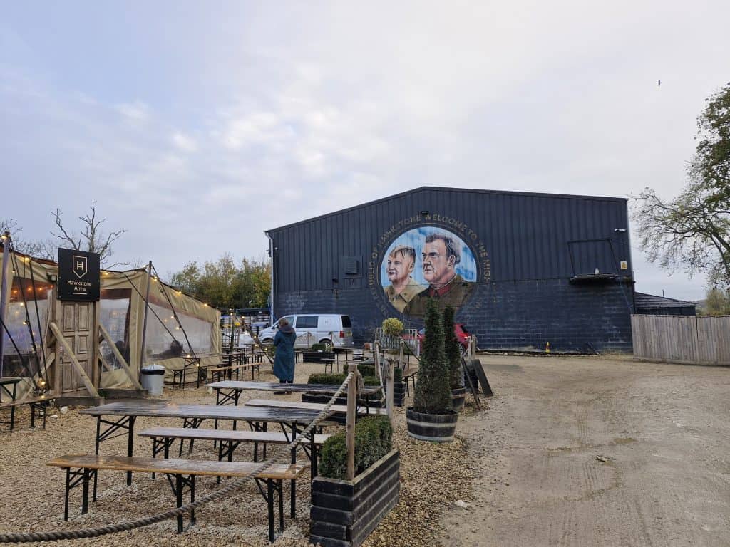 View at the outside area at Hawkstone brewery with Jeremy and Kaleb painted on the wall.