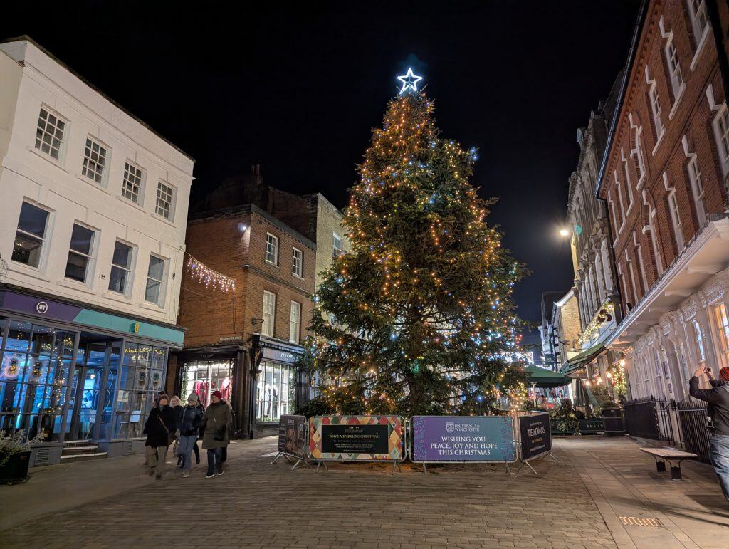 Winchester centre at night with the Christmas tree.