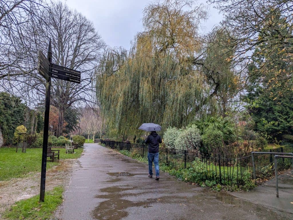 A person walking in Winchester on a rainy day.
