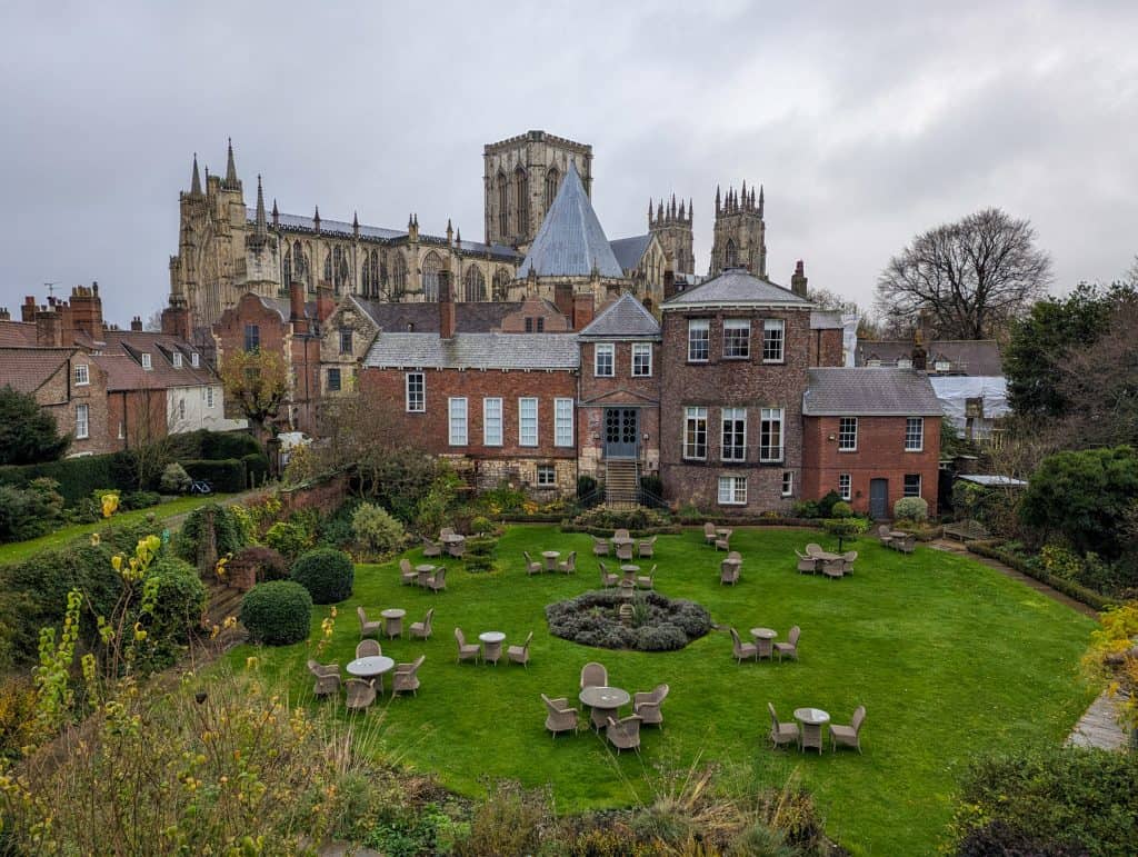 A view at the York Minster Cathedral with gardens and buildings from the City Walls.